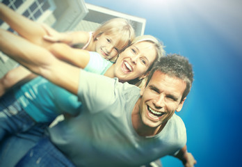 Fototapeta premium Happy family near the house