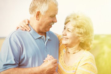 Old people over field background