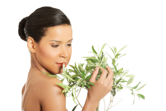 Woman With Health Skin And With Olive Tree