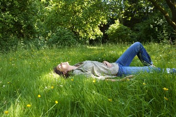 Woman lying down in garden