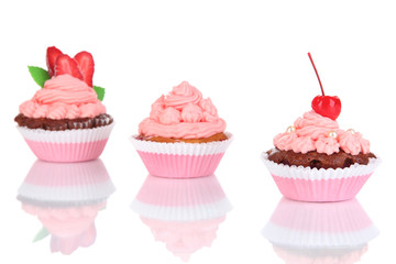 Delicious beautiful cupcakes isolated on white