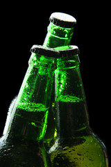 Bottles of beer on black background