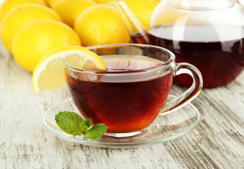 Cup of tea with lemon on table close-up