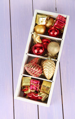 Wooden box filled with christmas decorations,