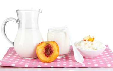 Fresh dairy products with peaches isolated on white