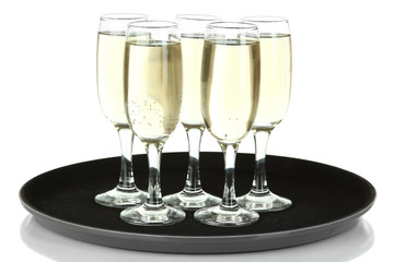 Many glasses of champagne on the tray, isolated on white