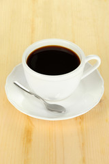 Coffee cup on wooden table close-up