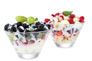 Fruit salad in glass bowls, isolated on white