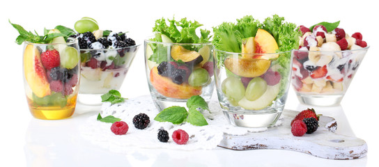 Fruit salad in glasses, isolated on white