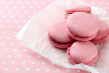 Gentle macaroons on table close-up