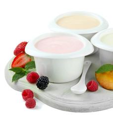 Delicious yogurt with fruit and  berries isolated on white