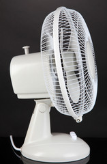 Electric fan on grey background