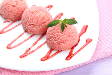 Delicious ice cream on plate on table close-up