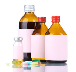 Pills and medicine bottles isolated on white