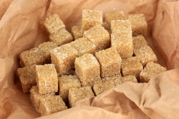 Brown sugar in paper close-up