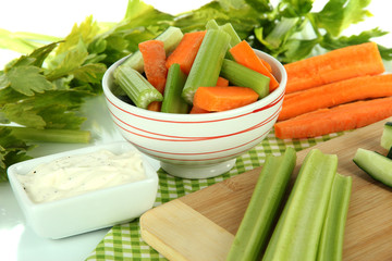 Fresh green celery with vegetables on table close-up