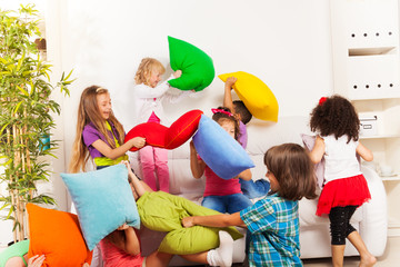 Kids playing pillow fight