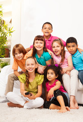 Fototapeta premium Group of kids with TV remote controll