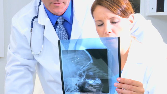 Radiologist Examining X-Ray Film Close Up 