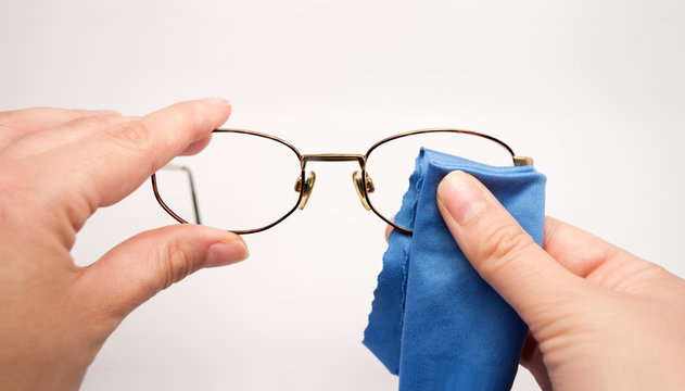 Woman Cleaning His Glasses