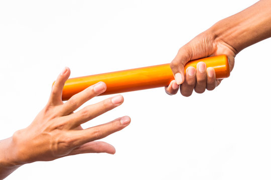 two hands passing a relay baton