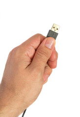 Hand holding black USB cable