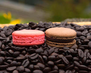 macaroon cookies on a background of coffee beans