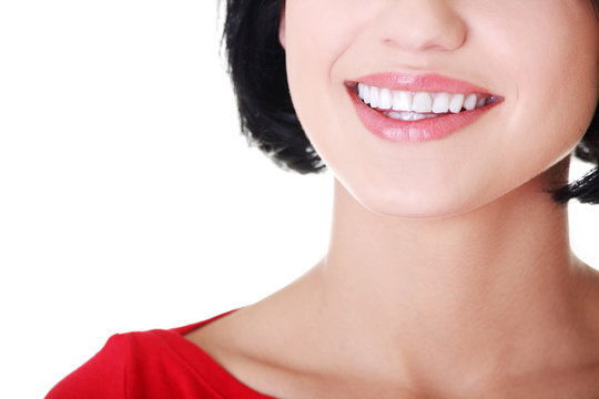 Beautiful woman with her perfect straight white teeth.