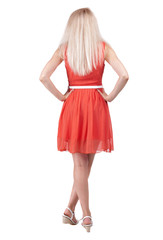 back view of standing young beautiful  woman.