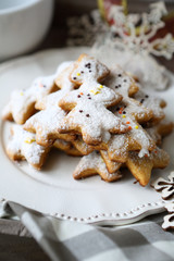 cookies in the shape of a Christmas tree on a white plate