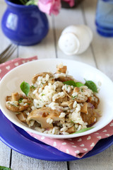 mushroom risotto in a white bowl