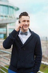 Portrait of a young businessman talking on phone