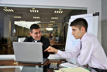 businessmen in his office