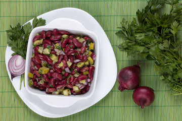 bean salad with onion cucumber and parsley