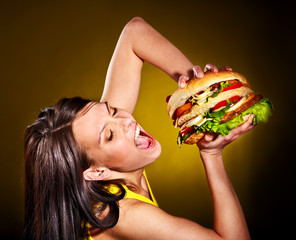 Woman holding hamburger.