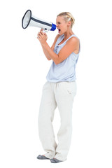 Naklejka premium Blonde screaming through megaphone