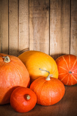 Pumpkins on grunge wooden backdrop background