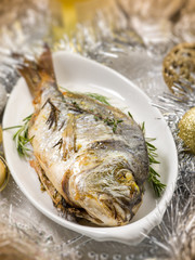grilled gilthead over christmas table