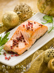 grilled salmon with pink pepper on christmas table