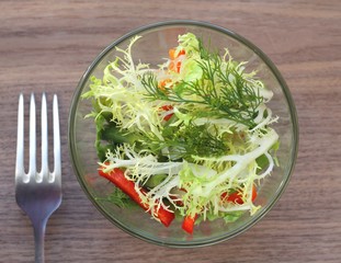 Glass bowl of fresh green salad