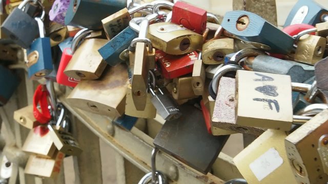 Love locks hang from a bridge
