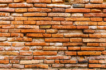 Ancient brick wall in red color