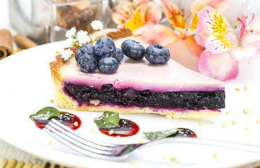 piece of blueberry pie on a table in a restaurant