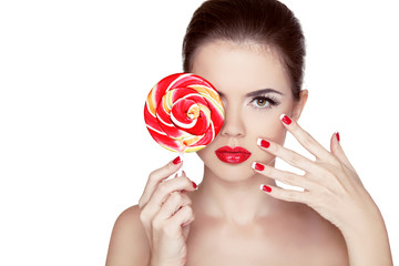 Fashion makeup. Beauty Girl Portrait holding Colorful lollipop.