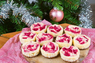 Dessert for Christmas. Mini raspberry cheesecakes in muffin form