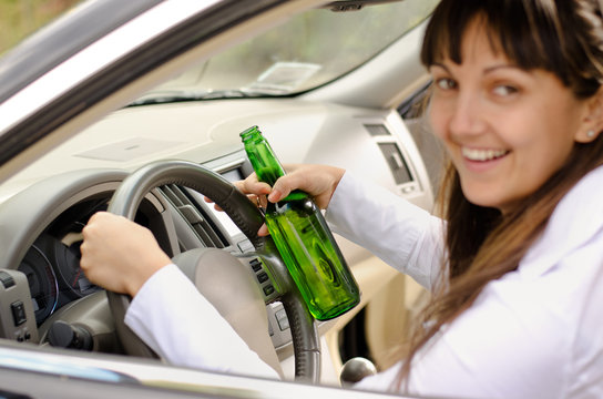 Female driver drinking and driving