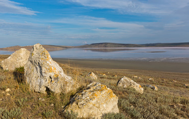 Fototapeta na wymiar stones with salt sea on background