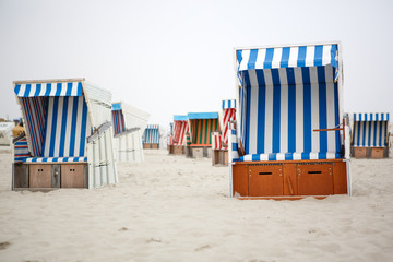 Colorful beach chairs with stripes at the beach of St.Peter Ordi