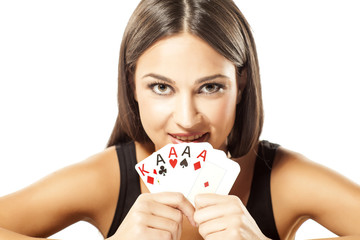 Happy girl holding the winning combination of poker cards
