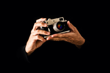 Man Holding Vintage Camera